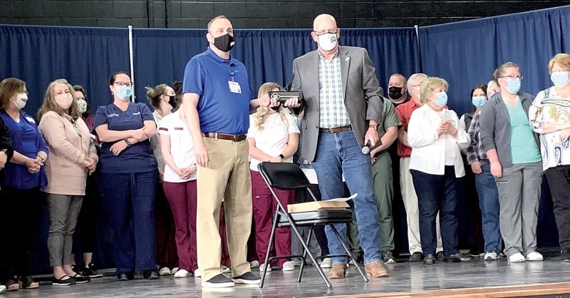 Clinic volunteers receive key to city
